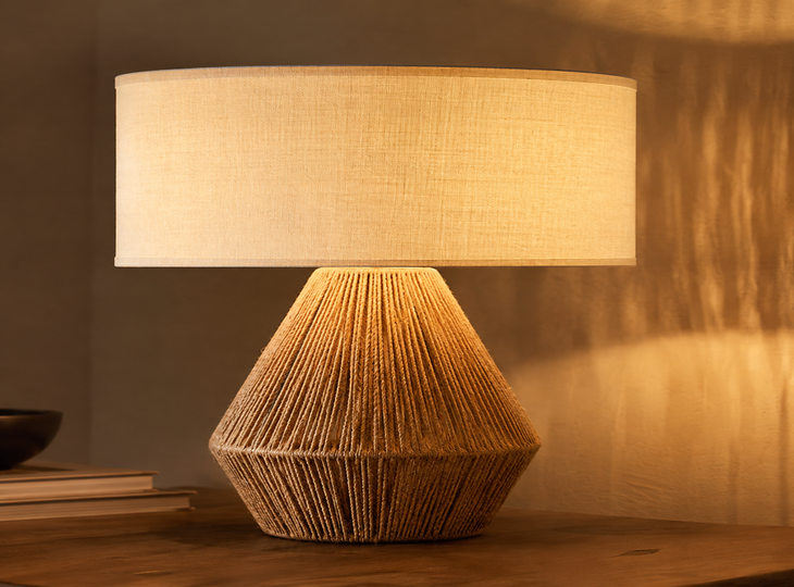 A natural-style table lamp, switched on